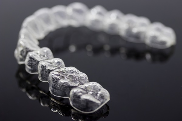 Invisalign bracces or invisible retainer isolated on black background